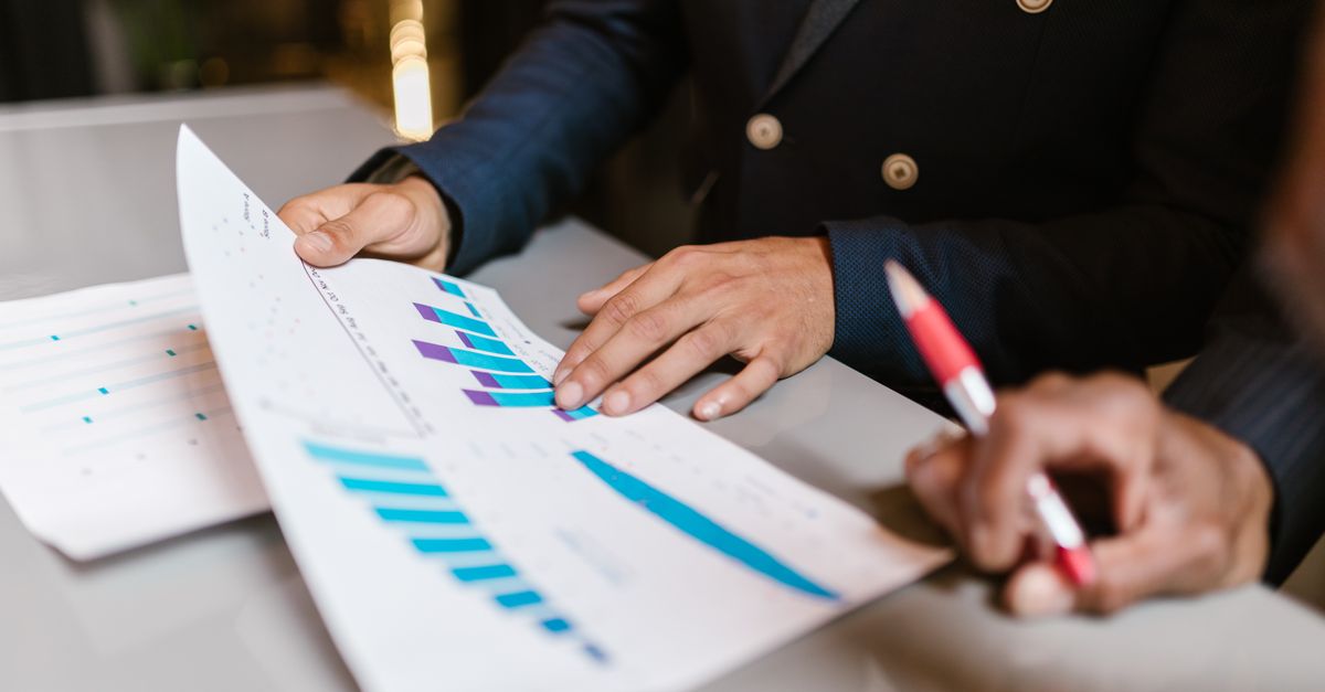 Business professionals reviewing financial performance charts