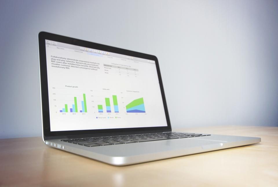 Laptop showing sales charts and analytics
